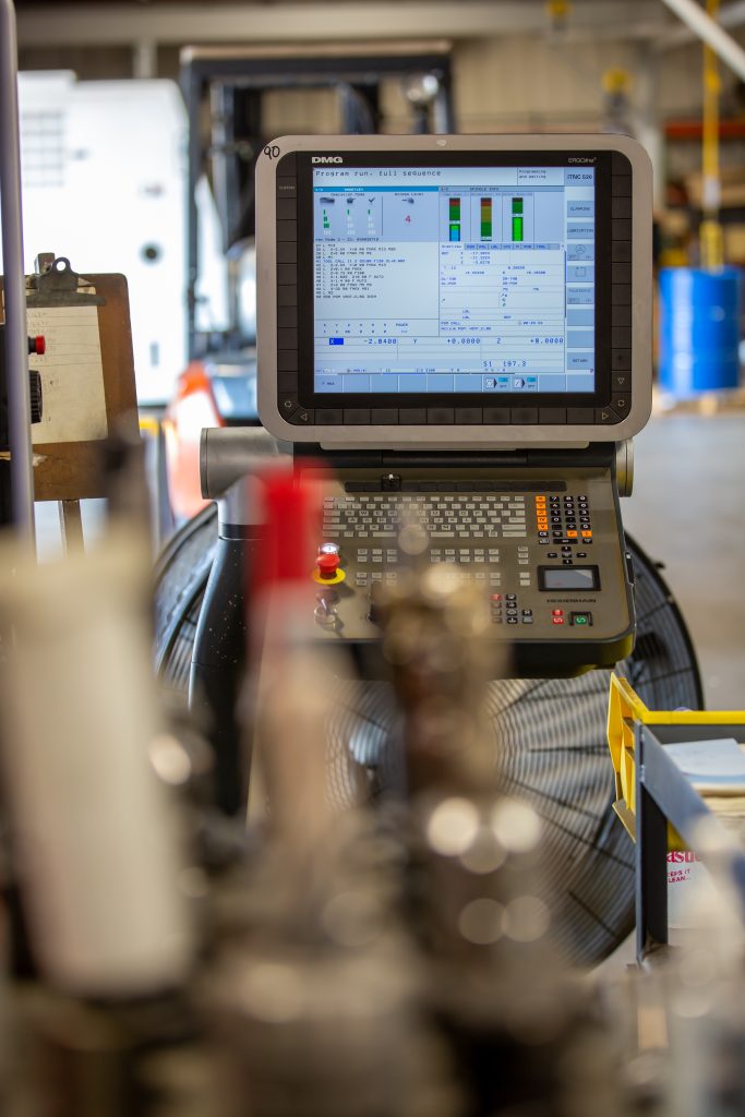 CNC machine computer running a program